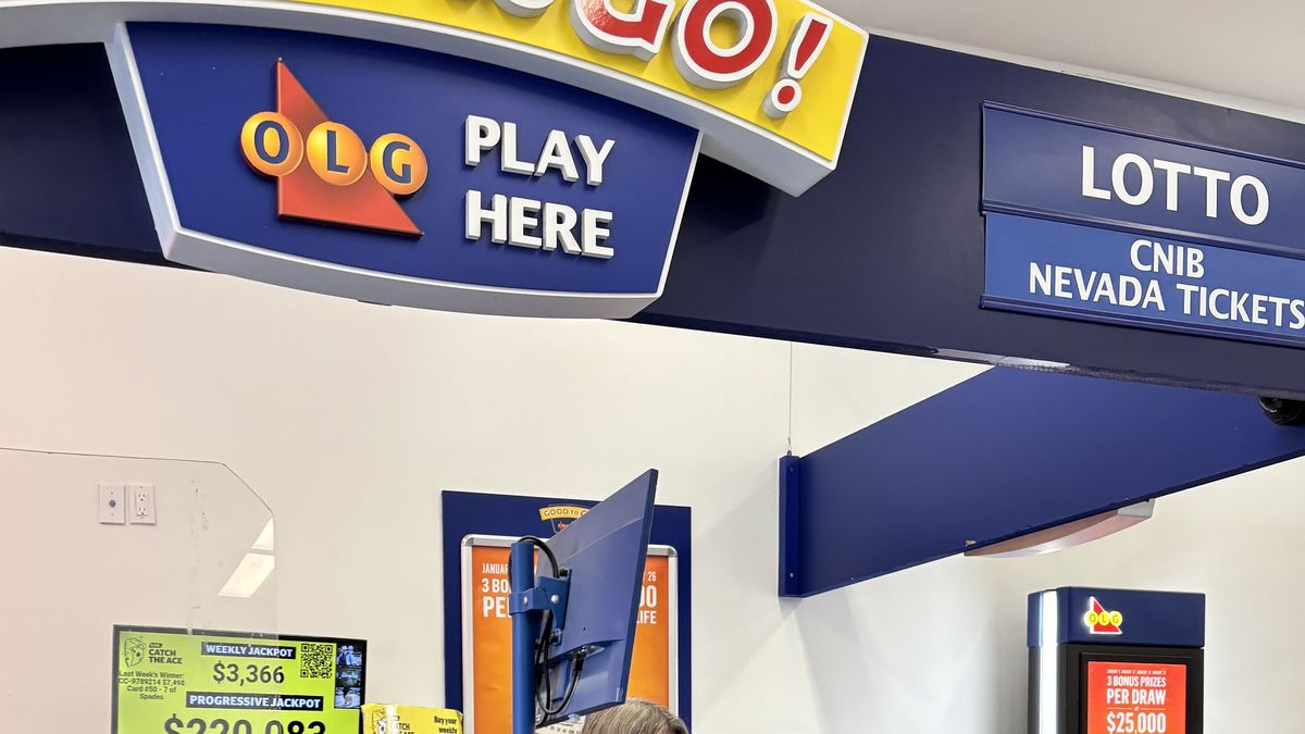 Lottery counter in an Ontario store with a hanging sign reading Lotto and CNIB Nevada Tickets above a jackpot display screen
